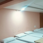 Unique 10-Bedded AC Rooms in Raichur – The Perfect Choice for Group Stays